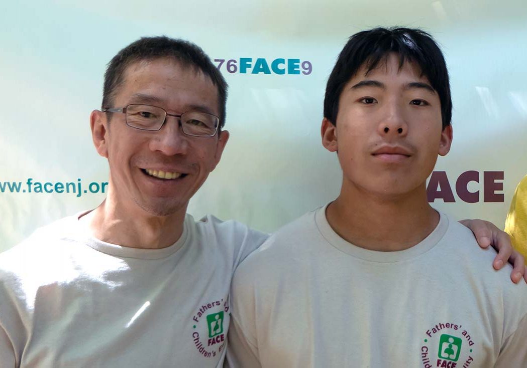 Asian father with teenage son